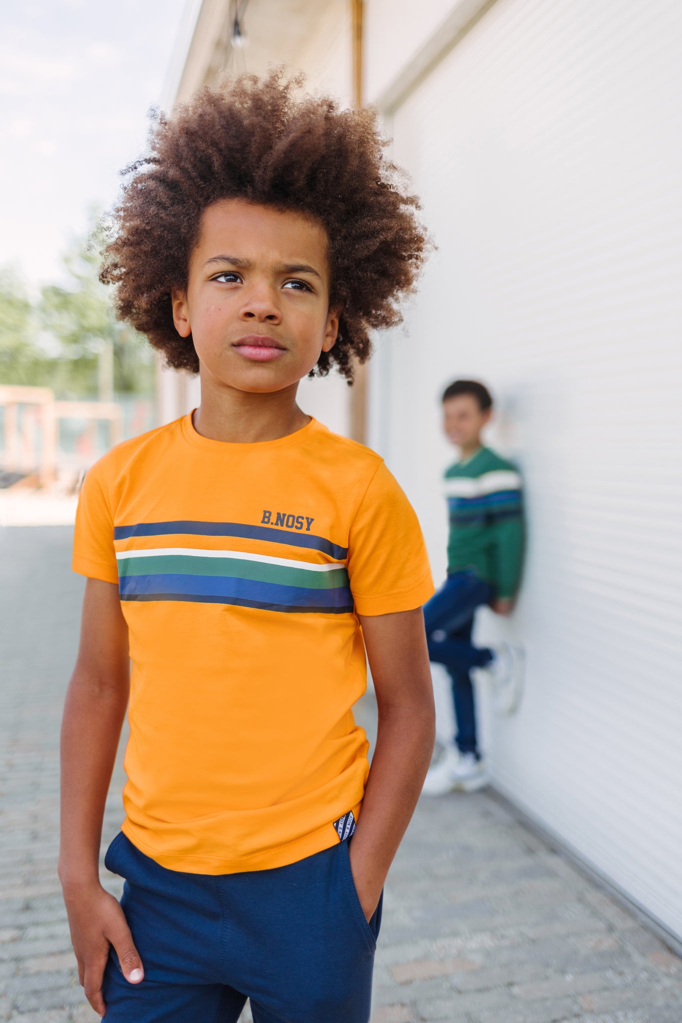 Boys ss shirt with multi color stripe artwork